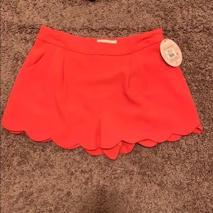 Scalloped shorts in coral and sea green